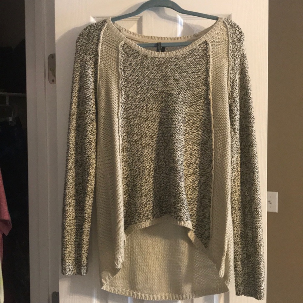 Cream and black sweater.